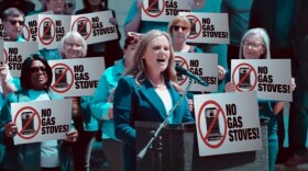 A new negative advertisement from Republican Mike Braun digitally altered the campaign signs at this Jennifer McCormick rally to say “No Gas Stoves!” The version sent to telesivions “mistakenly” omitted the legally mandated disclaimer at the bottom of the screen, according to Braun’s campaign.