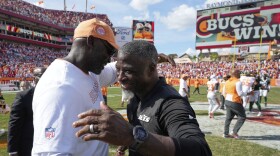 Tampa Bay Buccaneers head coach Todd Bowles, left, and New York Jets head coach Aaron Glenn, hug at the end of an NFL football game Sunday, Sept. 21, 2025, in Tampa, Fla. (AP Photo/Chris O'Meara)