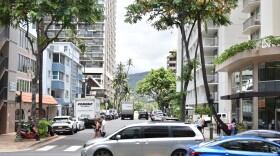 Cars drive through Waikīkī