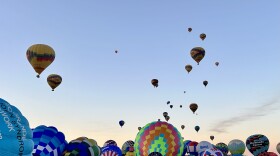 Hot air balloons starting to launch at Albuquerque's annual Balloon Fiesta