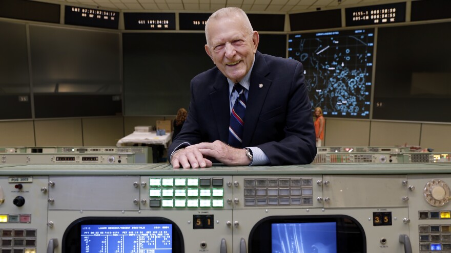 Gene Kranz stands behind the console at Mission Control in Houston where he worked during the Gemini and Apollo missions. [Michael Wyke / AP]