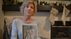 Tracy Noe displays a photo of her mother, Renee Fletcher, and her husband on their wedding day in 1954. This will be Noe's first Christmas without her mother who died from COVID-19 in May.