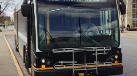A Columbia bus is pulled up to the sidewalk on the MU campus. In this episode of Reverberations, KBIA's Cass Isele explored how transit service in Columbia changed over time.