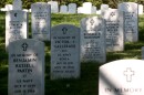 FILE - Rows of gravestones stand at the Arlington National Cemetery in Arlington, Va., May 13, 2014.