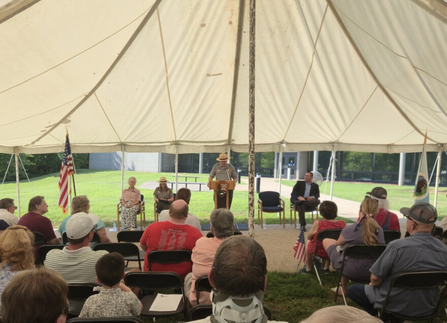 Wilson's Creek Battlefied museum curator Jeff Patrick speaks at the podium during the 165th anniversary of the battle. He shared the story of the 1st Iowa Infantry and their part in the battle.