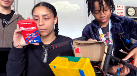 Brockton High senior Maura Barrada works with teammate Mya Evans and underclassman Julian Melendez on their drone, "Frankenstein."