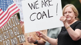Kay Medley protests climate change legislation in front of the Federal Building in Huntington, W.Va.  Opponents of the bill say it will impose taxes and cost millions of Americans their jobs.