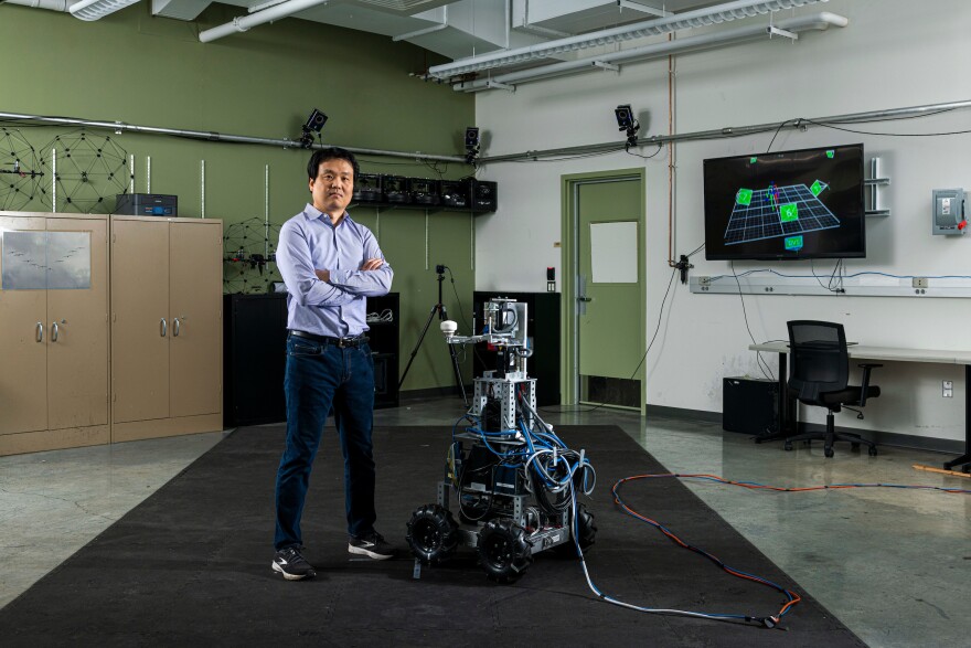 Missouri S&T professor Yun Seong Song and his team's robot he used to research physical human-robot interaction.