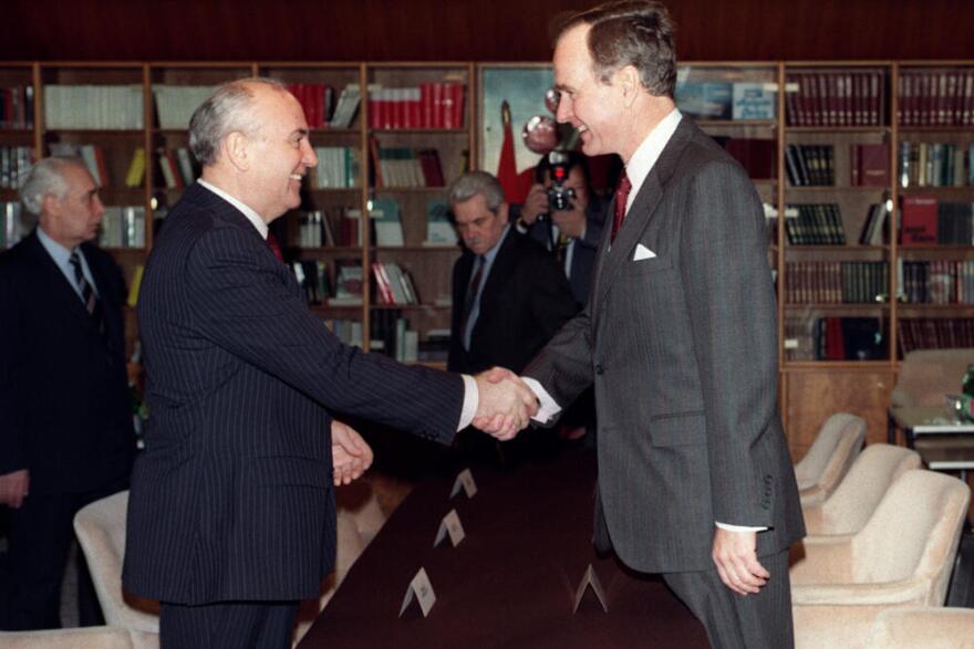 Soviet leader Mikhail Gorbachev (L) and U.S. President George Bush (R) shake hands on Dec. 2, 1989 on board the soviet cruise "Maxim Gorki", shipdocked at Marsaxlokk harbour, before the start of their first summit meeting, just a few weeks after the fall of the Berlin Wall. This summit is viewed as the official end of the Cold War. (Jonathan Utz/AFP via Getty Images)