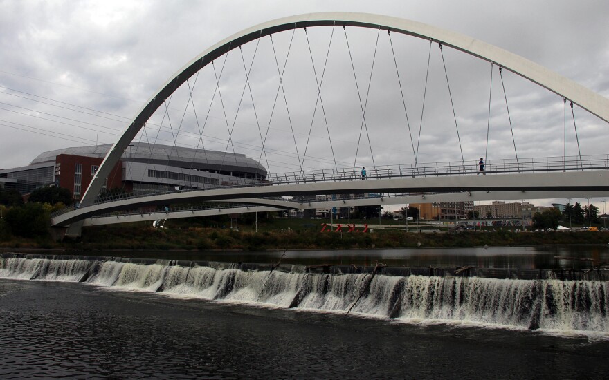 The Des Moines River spills over a low-head dam in downtown Des Moines.