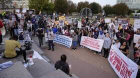 People protest against federal immigration enforcement Saturday, Nov. 15, 2025, in Charlotte, N.C. (Erik Verduzco/AP)