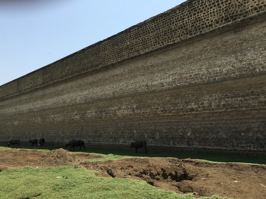 The Bendsura Project is now empty. The white line on the dam wall 20 feet up marks the old water line when the reservoir was flush with water just a few years back.
