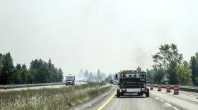 A section of I-90 is down to one lane due to heavy smoke near Cataldo, Idaho caused by fires in the area, July 7, 2021. CREDIT: Kathy Plonka/The Spokesman-Review via AP