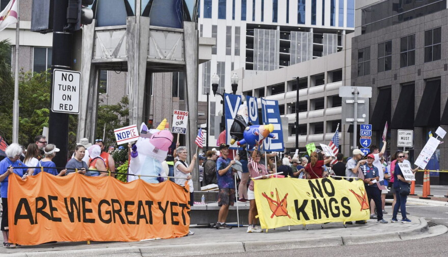 People gather for the No Kings: Vote Early rally in downtown Orlando on Saturday to encourage voter participation ahead of the midterm elections.
