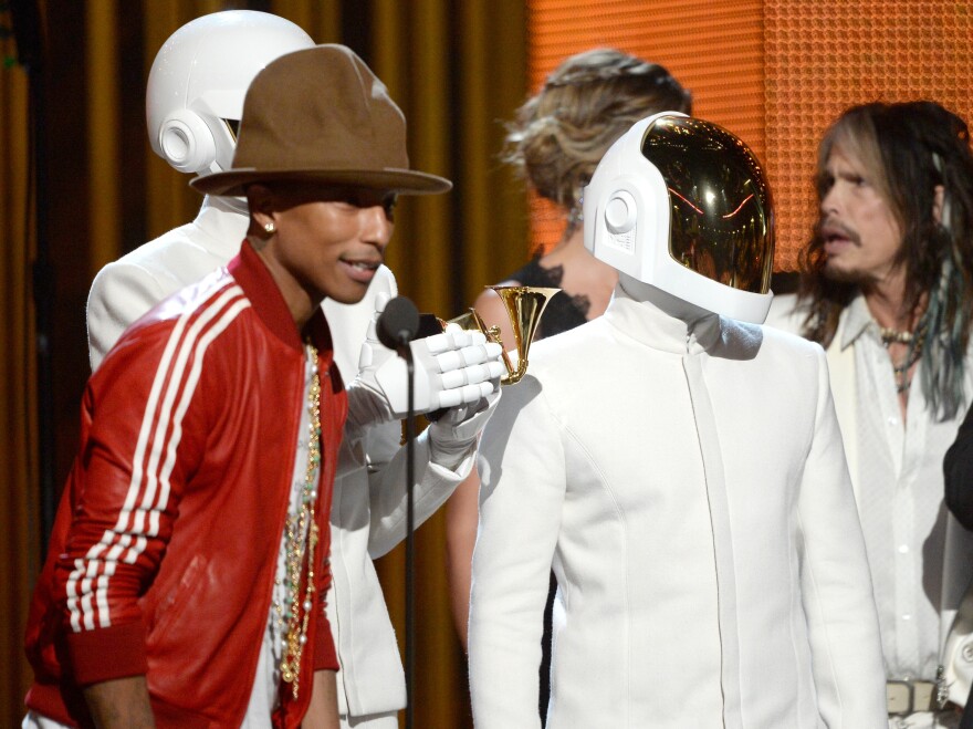 Pharrell Williams, with Thomas Bangalter and Guy-Manuel De Homem-Christo of Daft Punk, accepts the Record of the Year award for "Get Lucky."