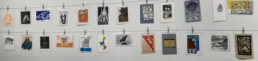 Prints on a clothesline. Whiteaker Printmakers Show. Maude Kerns Art Center