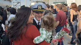 Families reunite at the homecoming for USS San Antonio.