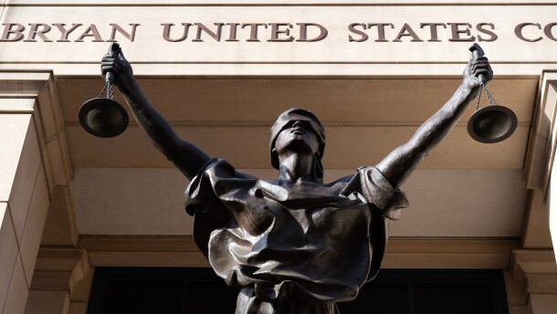 A bronze statue titled Justice Delayed, Justice Denied is seen at The Albert V. Bryan United States Courthouse, Friday, Sept. 26, 2025, in Alexandria, Va. (AP Photo/Jose Luis Magana)