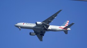 FILE - An American Airlines Boeing 777 is framed by utility wires as it prepares to land at Miami International Airport, Wednesday, Jan. 27, 2021, in Miami. An American Airlines flight landed safely in Los Angeles on Wednesday, March 13, 2024, after the flight crew reported a potential mechanical issue with the plane. 