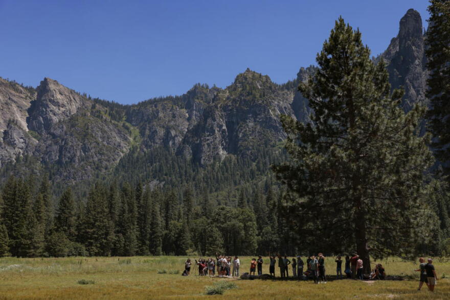 Visitors watch with binoculars for climbers on the face of El Capitan in the heart of Yosemite Valley is seen on June 12, 2026 in Yosemite National Park, California. (Heather Diehl/Getty Images)