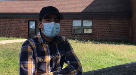 Samuel Gomez sits at the hotel where he and 100 or so other migrant farmworkers are living.