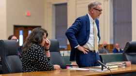  Cindy Palmer, former Cherokee County Department of Social Services Director, dabs her eyes in court Oct. 26, 2021, in Murphy after accepting a deal to plead guilty to obstruction of justice. Her lawyer Hart Miles addresses the court. 