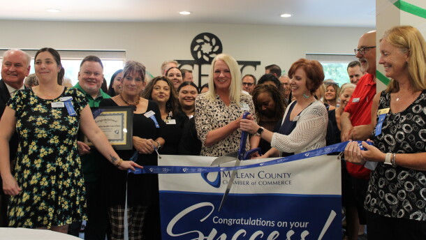 Attendees surround Executive Director Holly Wayland-Hall