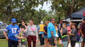 Visitors walk through the vendor booths at the Central Florida Peanut Festival in Heritage Park in Williston on Saturday, Oct. 3, 2026. (Hailey Hoffmann/WUFT News)