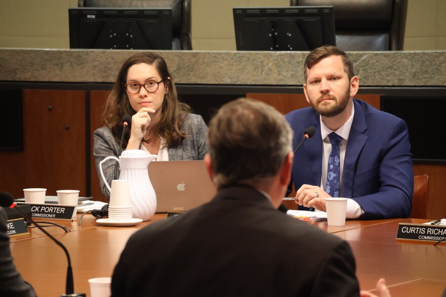 Tallahassee Commissioners Jack Porter and Jeremy Matlow watch FSU President Richard McCullough speak during the October 1st meeting.