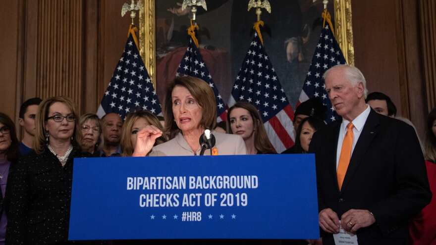 House Speaker Nancy Pelosi, D-Calif., holds a press conference with former Rep. Gabrielle Giffords, left, and Rep. Mike Thompson, D-Calif., to introduce legislation on expanding background checks for gun sales at the Capitol in Washington, D.C., Tuesday.