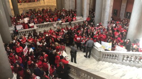 Teachers and their allies congregate at the base of the Kentucky House steps to protest a number of bills on day 25 of the 30-day session on March 6, 2019.
