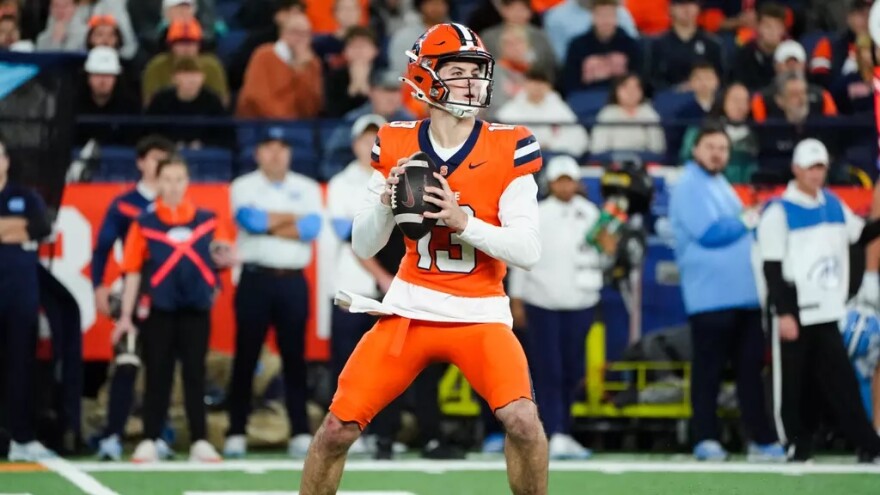 QB Joe Filardi (13, Orange) drops back during Syracuse’s loss to North Carolina.
