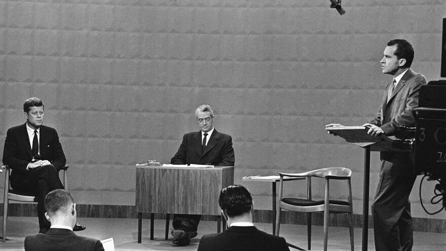 Vice President Richard Nixon speaks at the first general election presidential debate as Sen. John F. Kennedy listens on Sept. 26, 1960. Sitting in the center is moderator Howard K. Smith.