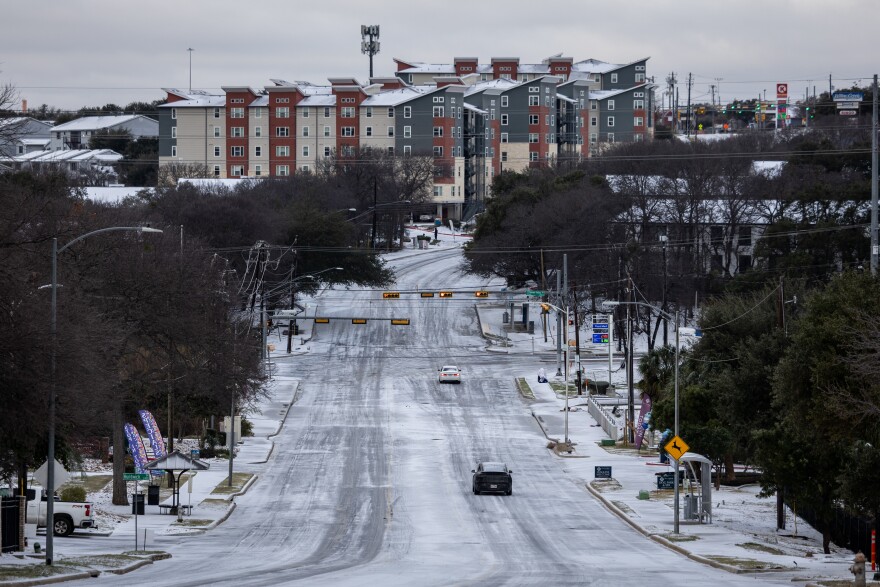 Ice and sleet cover a street intersection on Oltorf Street in South Austin Sunday.