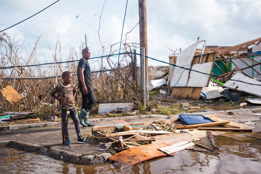 People take in the damage from Hurricane Irma in Marigot on the island of St. Martin on Thursday.