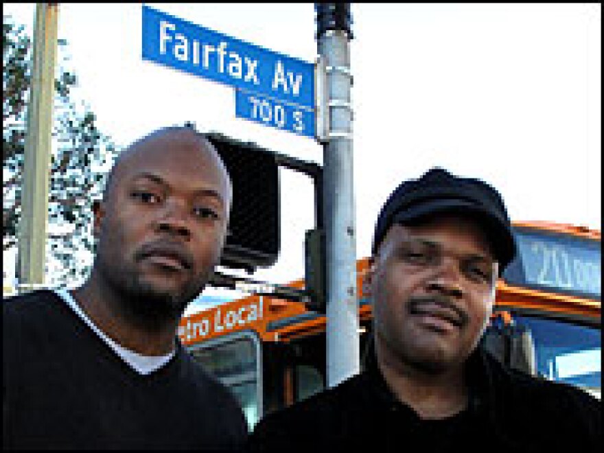 <strong>'The Shot Heard 'Round The World':</strong> <em>Notorious</em> screenwriters Cheo Hodari Coker and Reggie Rock Bythewood at the Los Angeles intersection where Christopher Wallace was fatally shot.