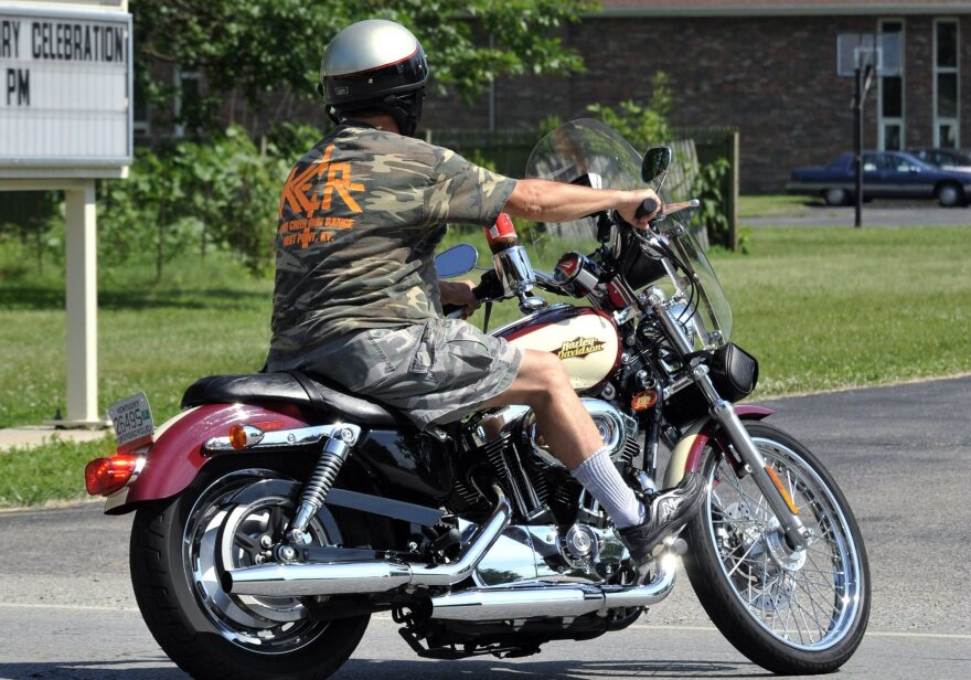 As of Wednesday, Kentucky has made it legal for people on motorcycles to run red lights after waiting for them to change. A motorcyclist rides in Kentucky in this file photo.
