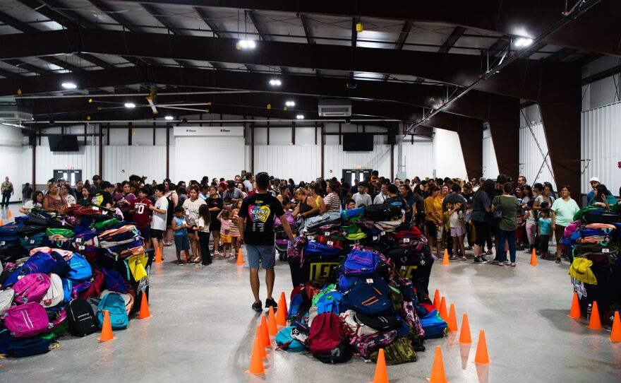 There was a sizable turnout at Lerner & Rowe Gives Back's backpack giveaway last year.