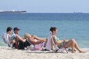 Beachgoers face the sun on Fort Lauderdale beach, Thursday, Dec. 22, 2022. South Florida attracted the highest amount of individual income moving from 2020 to 2021.