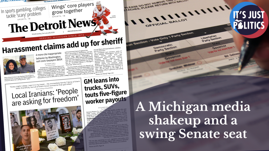 A Detroit newspaper next to a person filling in a ballot