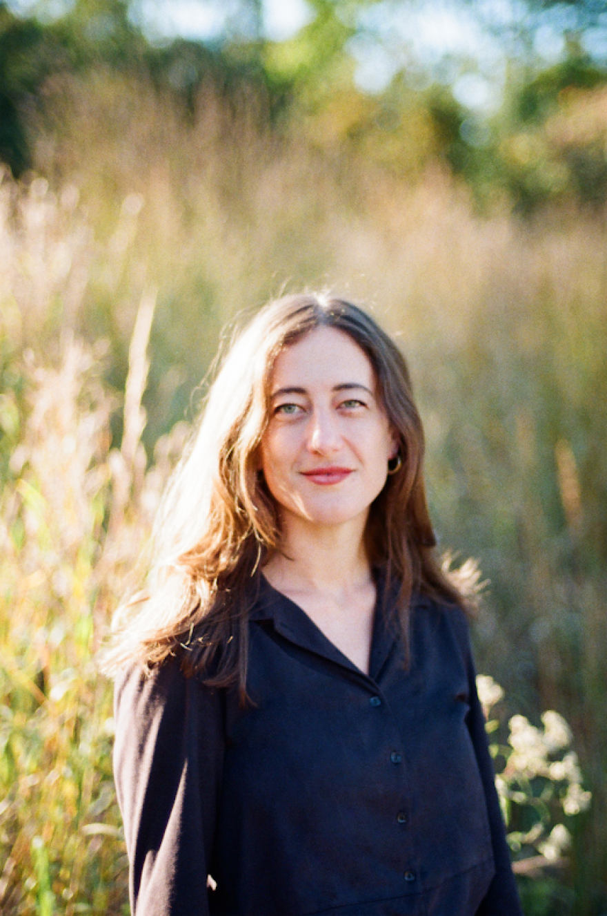 Woman outdoors looking into camera