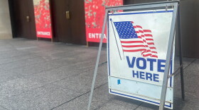 A "Vote Here" directs voters into the National WWl Museum & Memorial on August 4, 2026.