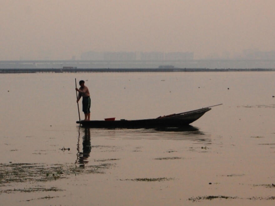 <p> A crab fisherman plies Yangcheng Lake in the city of Suzhou, not far from Shanghai. The lake is reputed to produce the tastiest crabs in China, but most crabs raised in Yangcheng actually come from somewhere else.</p>