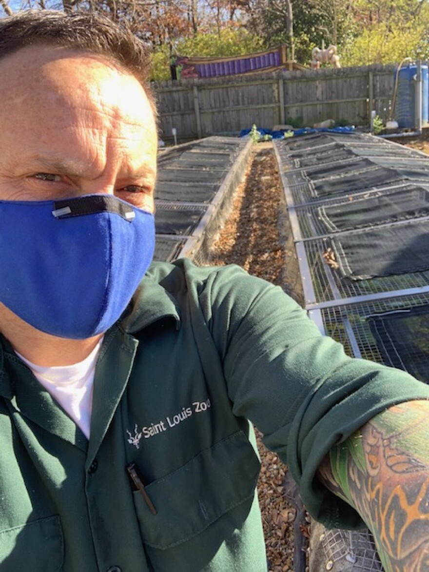 St. Louis Zoo herpetology manager, Mark Wanner, takes a selfie by the zoo's outdoor streams. 