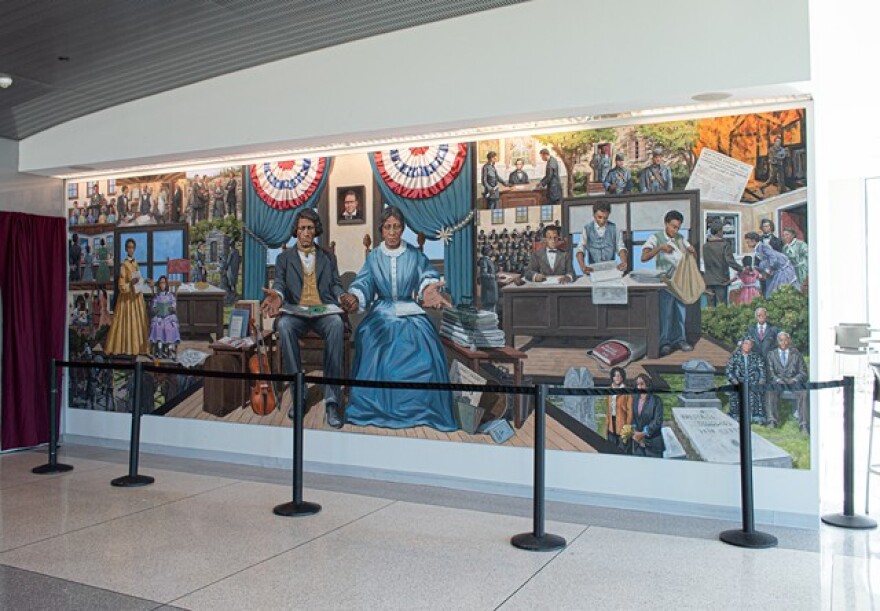 A new mural based on the lives of Frederick Douglass, his family members, and close associates, now hangs in the public flight observation deck at the Frederick Douglass Greater Rochester International Airport.