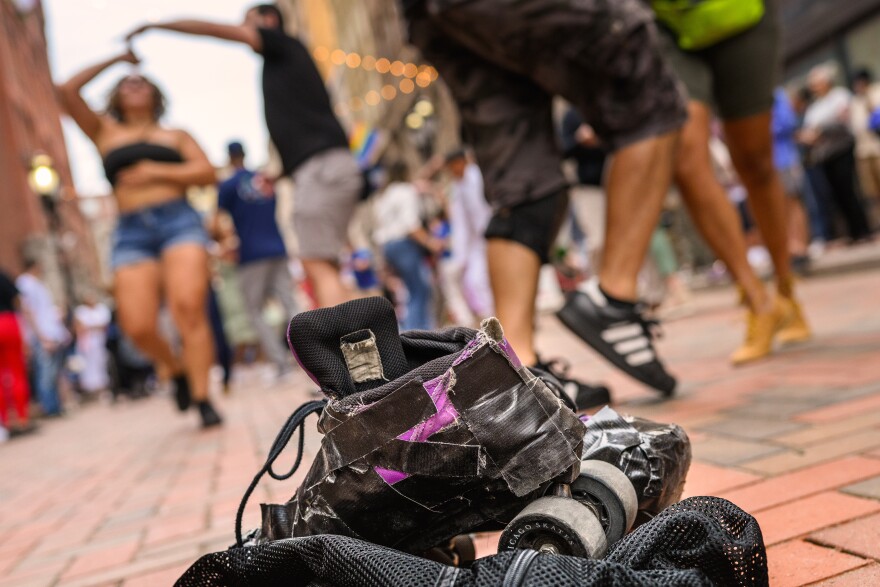 Roller skates worn by Salsa lover Hayro Mayorga of Norwalk rest on the bricks of Pratt Street in downtown Hartford as he joins hundreds of dancers in a Pratt Street Salsa Social. “No one can tell you how your body translates music,” Mayorga said. “There's no one there that can dictate how you intake and listen to music and express yourself. So even if you think you're acting a fool, don't think about that. It's all about having fun.”