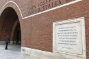 Etchings on the federal courthouse in Boston acclaim a well-administered justice system, but many working in the building say that is getting harder, given the continuing federal shutdown.