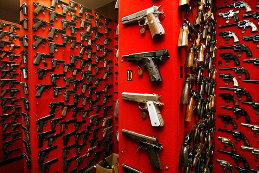 Guns line the walls of the firearms reference collection at the Washington Metropolitan Police Department headquarters in Washington, D.C.