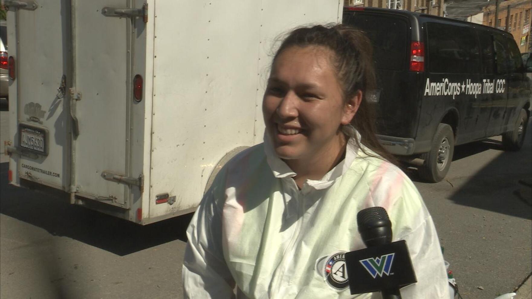 Volunteer smiles as she talks about why she traveled for five days to help West Virginian flood victims