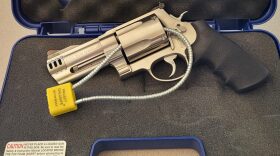 S&W 500 Magnum revolver hand gun with cable key locked on case background